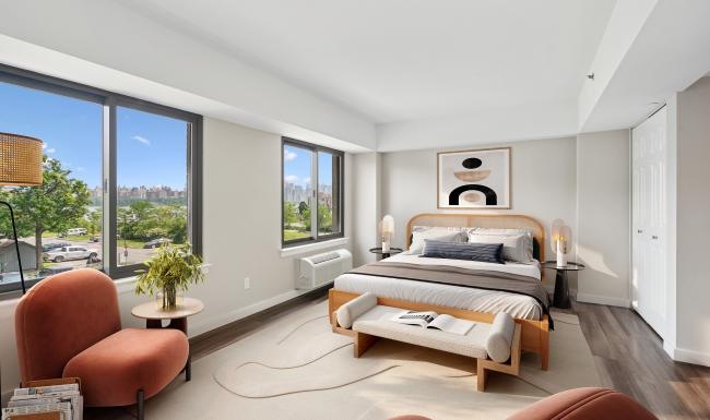 a bedroom with a large window