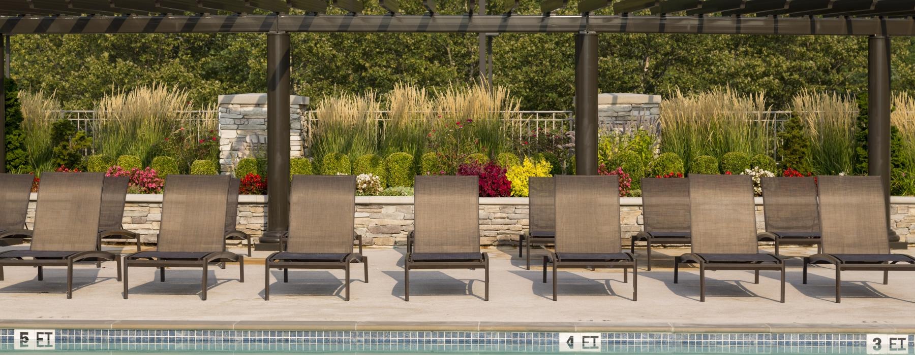 a pool with chairs around it