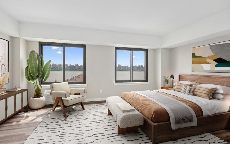 a bedroom with a bed and a chair